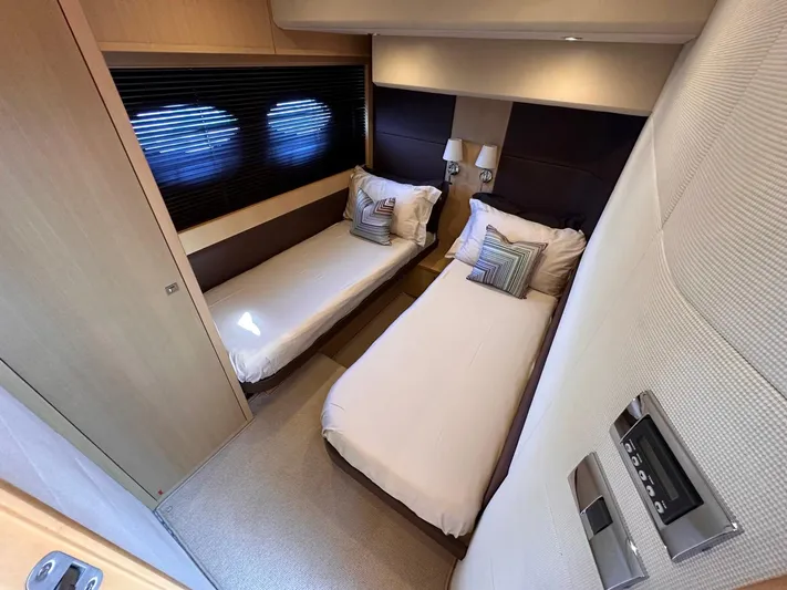  Yacht Photos Pics Twin cabin in 2009 Princess V62 yacht with modern decor and cozy bedding.