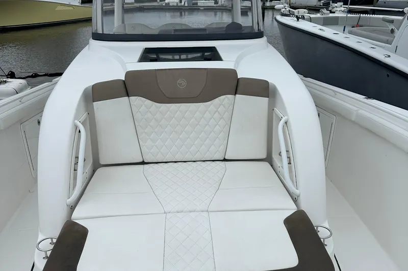 Bali Hai Yacht Photos Pics 2020 Edgewater 370CC boat interior with cushioned seating and elegant design.
