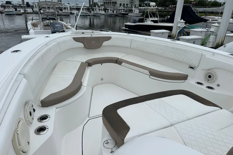 Bali Hai Yacht Photos Pics 2020 Edgewater 370CC boat with spacious seating at a marina.