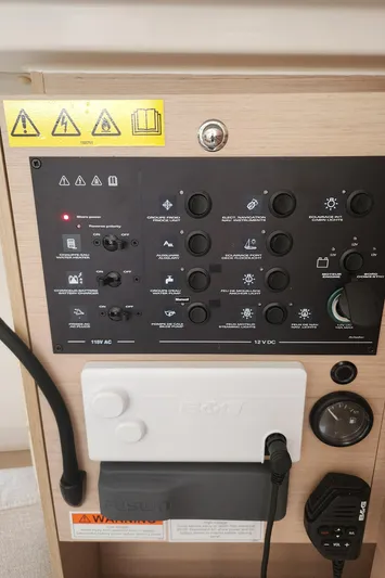 Sea Saw Yacht Photos Pics Electrical control panel on 2023 Beneteau Oceanis 30.1 sailboat, featuring various switches and indicators.