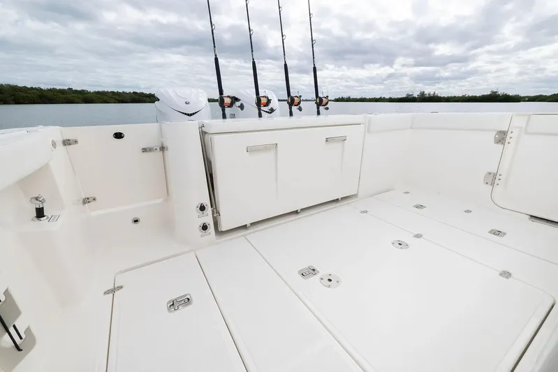  Yacht Photos Pics Manufacturer Provided Image: 2025 Pursuit S 328 Sport boat deck with fishing rods, spacious and sleek design.