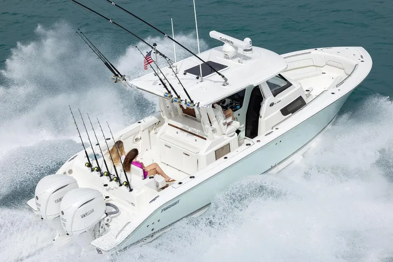 Yacht Photos Pics Manufacturer Provided Image: 2025 Pursuit S 328 Sport boat cruising on water with fishing rods.