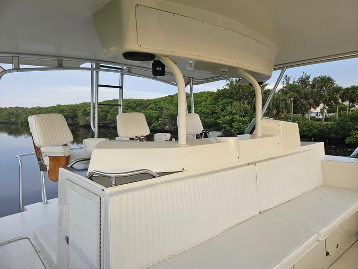  Yacht Photos Pics 1991 Donzi 65 Sportfisherman boat interior with white seating and helm station.