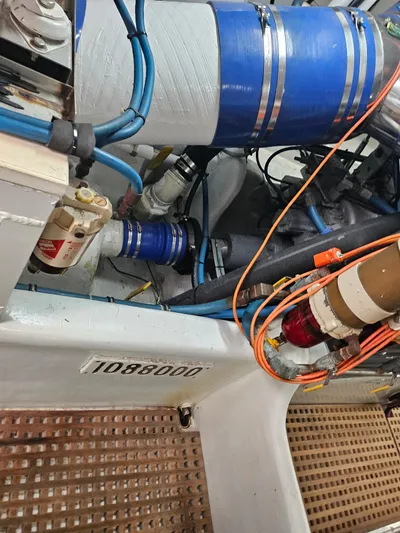  Yacht Photos Pics Engine compartment of a 1991 Donzi 65 Sportfisherman boat with visible wiring and components.