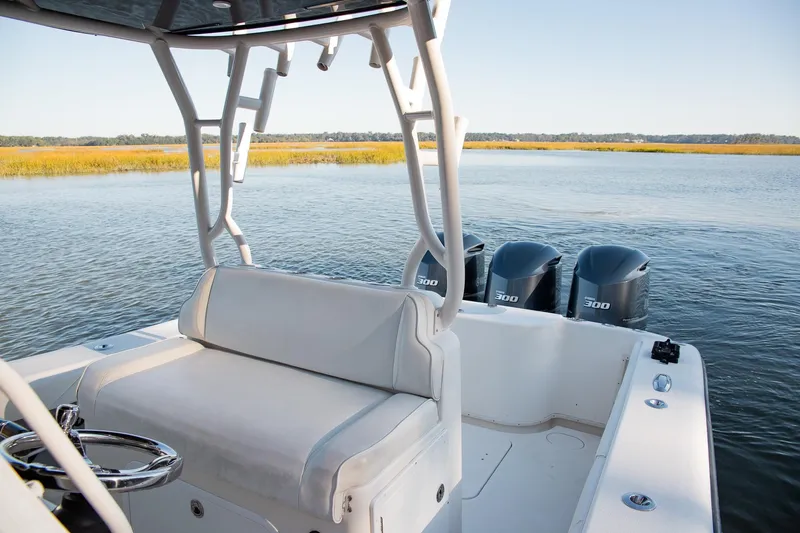  Yacht Photos Pics 2014 Yellowfin 34 Offshore boat with triple 300 horsepower engines on calm water.