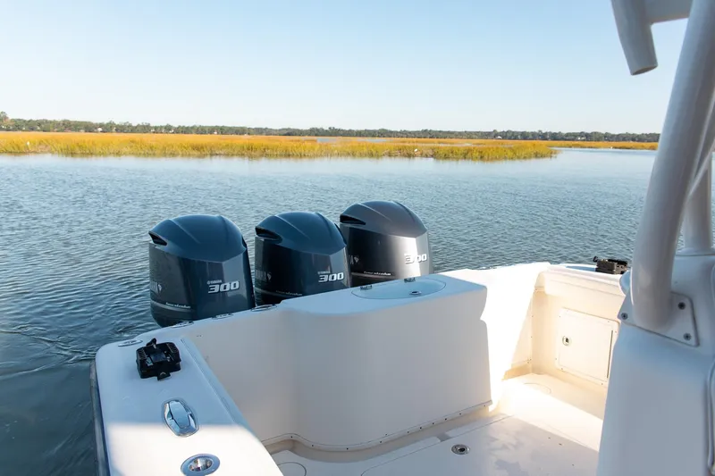  Yacht Photos Pics 2014 Yellowfin 34 Offshore boat with triple Yamaha 300 engines on calm water.