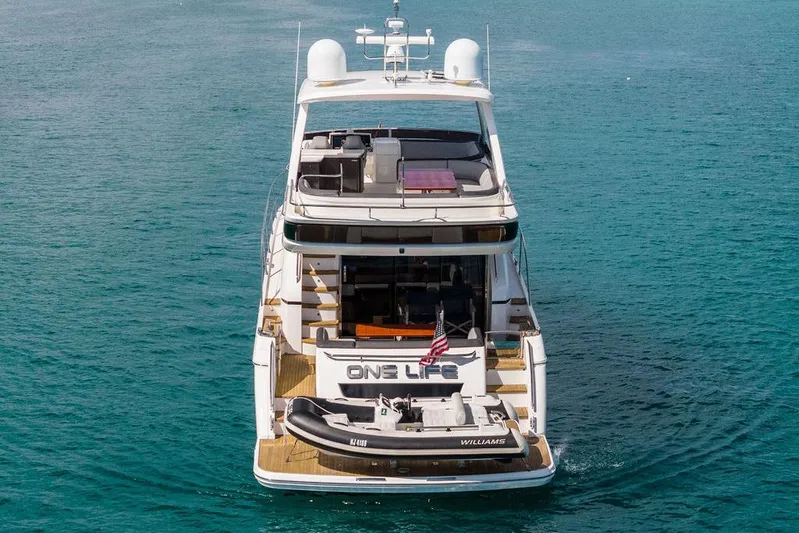 One Life Yacht Photos Pics 2016 Princess 60 Flybridge Motor Yacht on open water, rear view.