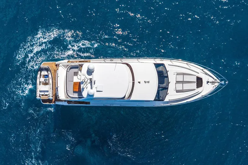 One Life Yacht Photos Pics Aerial view of 2016 Princess 60 Flybridge Motor Yacht cruising on blue ocean waters.