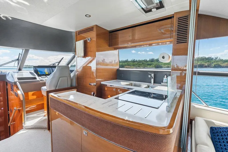 One Life Yacht Photos Pics Luxurious interior of 2016 Princess 60 Flybridge Motor Yacht with modern kitchen and helm.