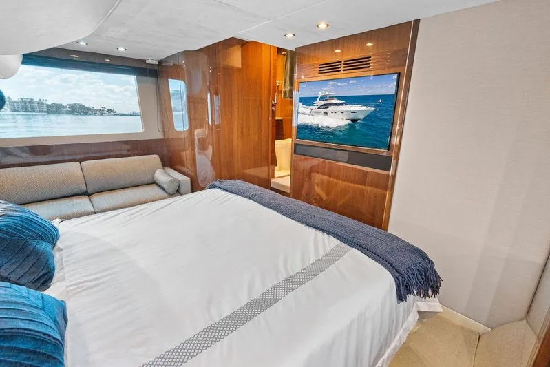 One Life Yacht Photos Pics Luxurious bedroom interior of 2016 Princess 60 Flybridge Motor Yacht with scenic window view.