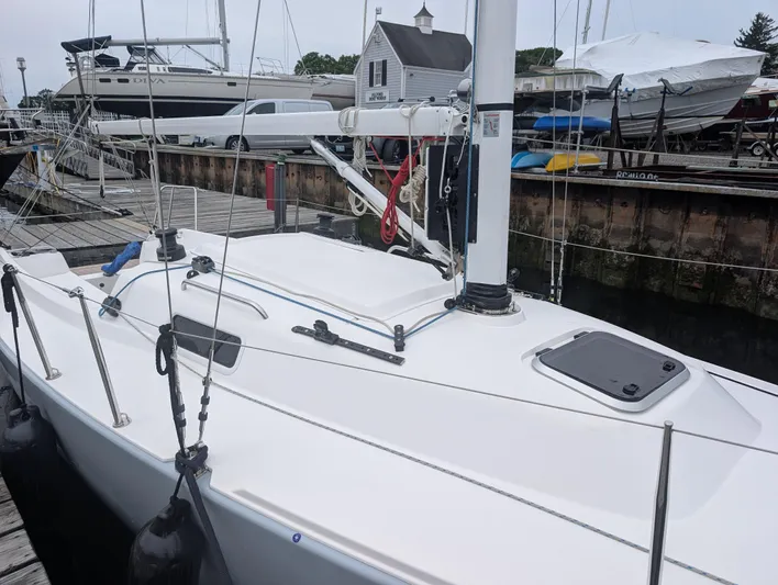  Yacht Photos Pics 2023 J Boats J/9 sailboat docked at marina, showcasing sleek design and modern features.