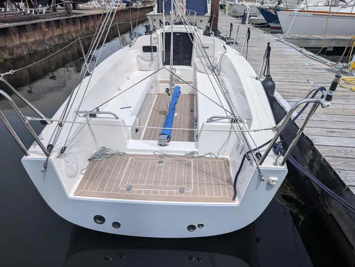  Yacht Photos Pics 2023 J Boats J/9 sailboat docked, showcasing spacious cockpit and sleek design.