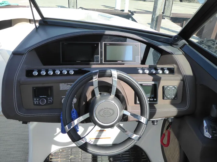  Yacht Photos Pics 2017 Cobalt R30 boat dashboard with steering wheel and electronic displays.