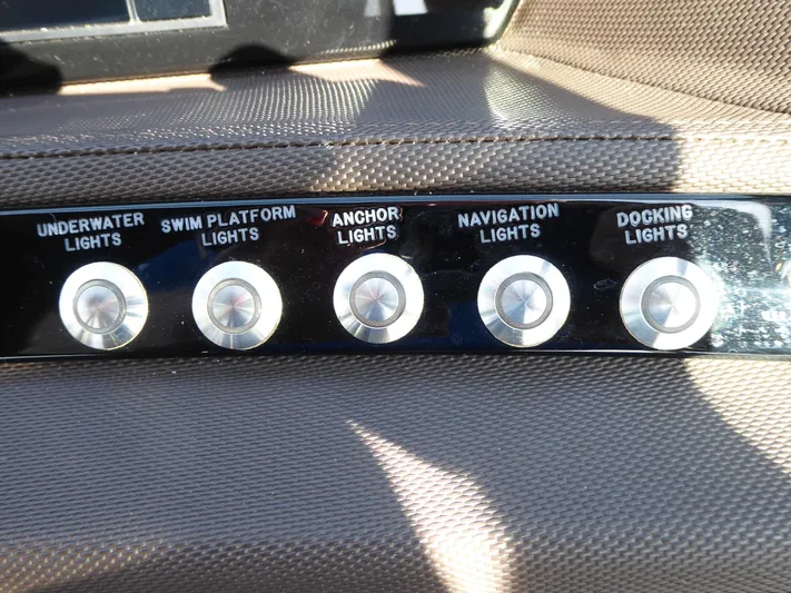  Yacht Photos Pics Control panel of a 2017 Cobalt R30 boat with various light switches.