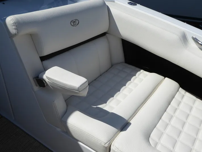  Yacht Photos Pics Luxurious white seating in a 2017 Cobalt R30 boat, featuring quilted upholstery and armrest.