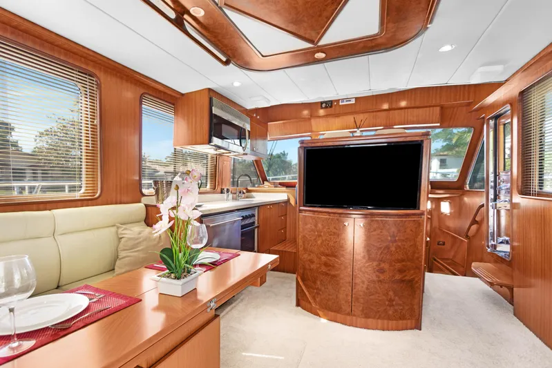  Yacht Photos Pics Luxurious interior of 2006 Noresman 480 Sedan yacht with wood finishes and modern amenities.