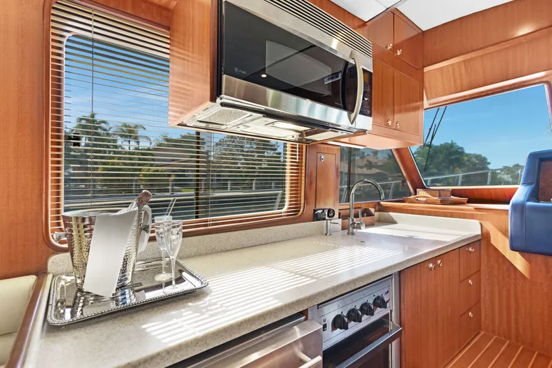  Yacht Photos Pics Luxurious kitchen interior of 2006 Noresman 480 Sedan yacht with modern appliances.