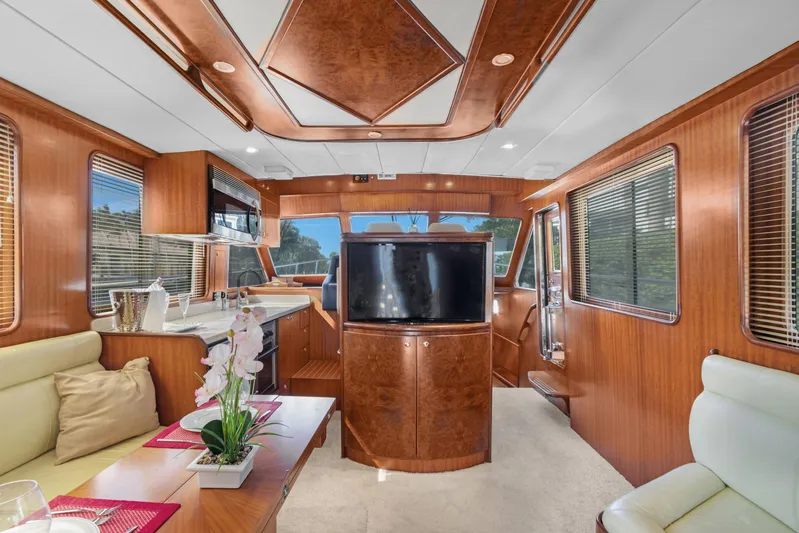  Yacht Photos Pics Luxurious interior of 2006 Noresman 480 Sedan yacht with wood finishes and modern amenities.