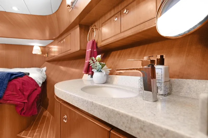 Yacht Photos Pics Luxurious bathroom interior of 2006 Noresman 480 Sedan yacht with elegant wood finish.