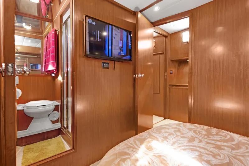  Yacht Photos Pics Luxurious 2006 Noresman 480 Sedan interior with wood paneling, TV, and bathroom.