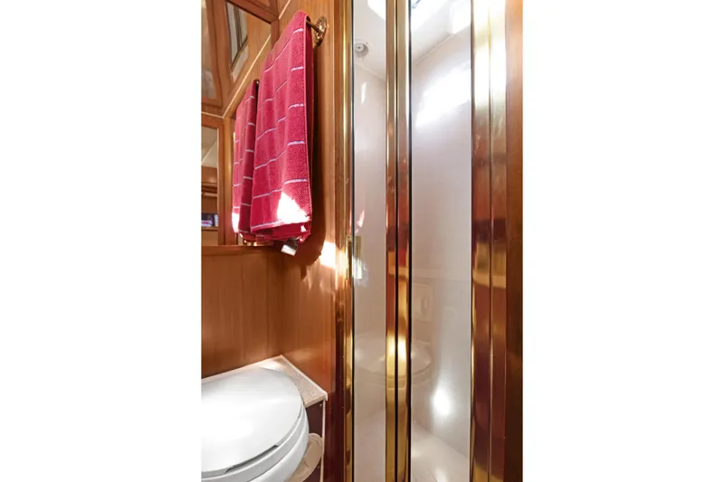  Yacht Photos Pics Bathroom interior of 2006 Noresman 480 Sedan with shower and red towel.