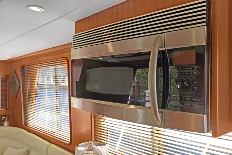  Yacht Photos Pics Modern kitchen interior in 2006 Noresman 480 Sedan with stainless steel microwave.