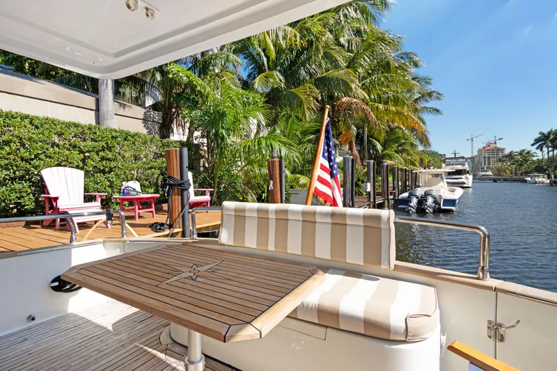  Yacht Photos Pics Deck view from 2006 Noresman 480 Sedan yacht, featuring waterfront and palm trees.