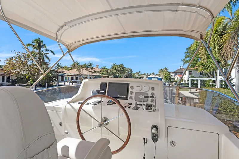  Yacht Photos Pics Helm of 2006 Noresman 480 Sedan yacht with steering wheel and navigation equipment.