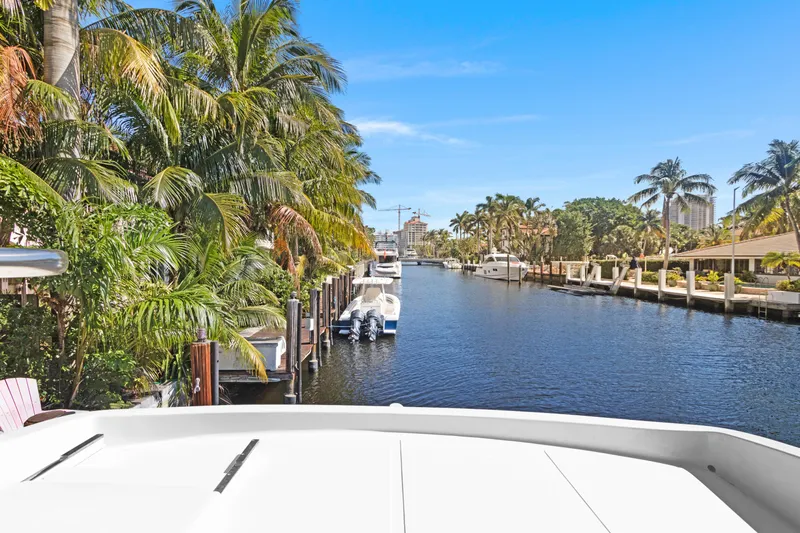  Yacht Photos Pics Tropical waterfront view from a 2006 Noresman 480 Sedan yacht, surrounded by palm trees and boats.