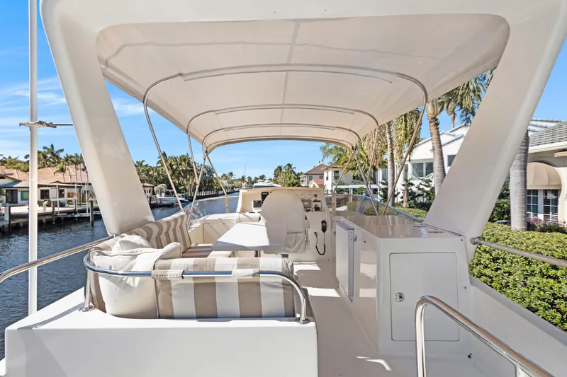  Yacht Photos Pics Luxurious 2006 Noresman 480 Sedan yacht interior with elegant seating and scenic waterfront view.