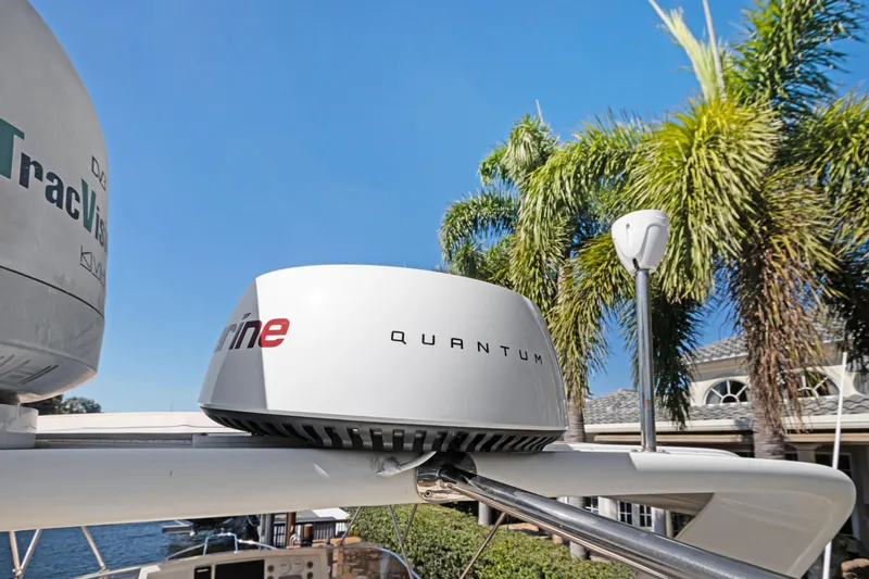  Yacht Photos Pics Radar equipment on a 2006 Noresman 480 Sedan yacht, with palm trees in the background.