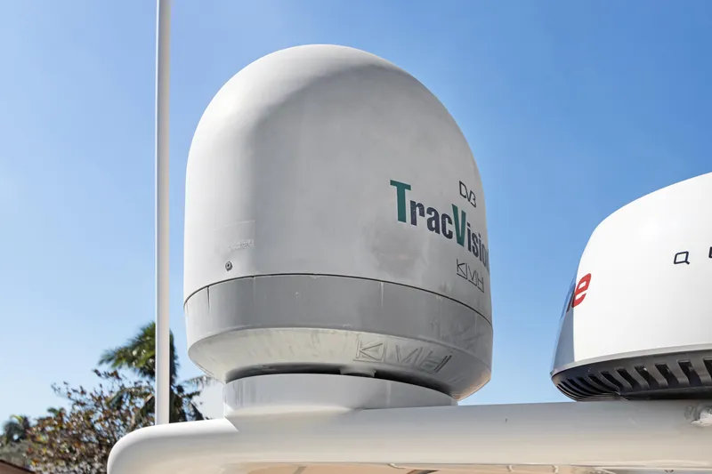  Yacht Photos Pics Satellite dome on 2006 Noresman 480 Sedan, featuring TracVision technology against clear blue sky.