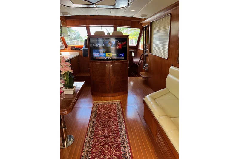  Yacht Photos Pics Luxurious 2006 Norseman 480S yacht interior with wood finish, TV, and elegant decor.