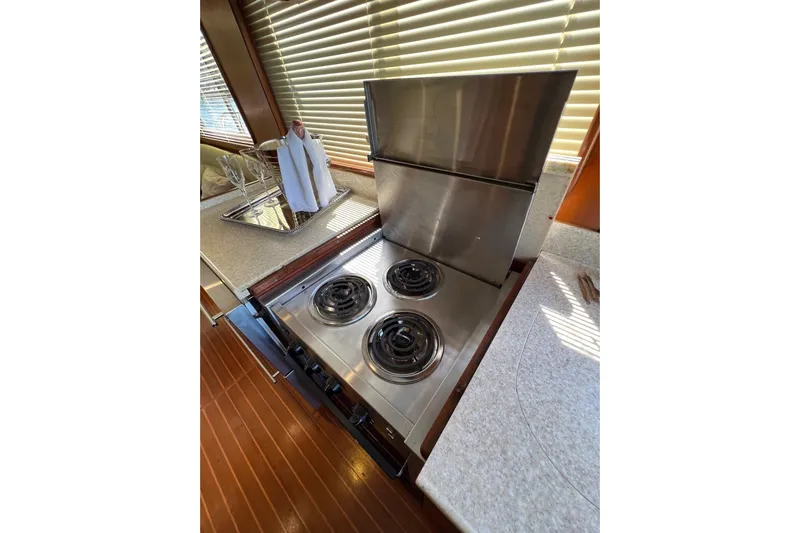  Yacht Photos Pics Stainless steel stove in 2006 Norseman 480S yacht kitchen with wooden flooring.