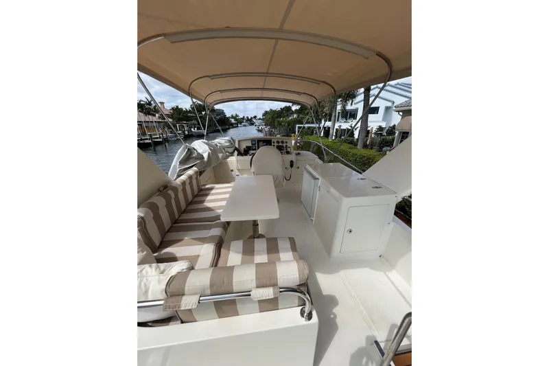  Yacht Photos Pics Spacious deck of 2006 Norseman 480S yacht with striped seating and canopy.