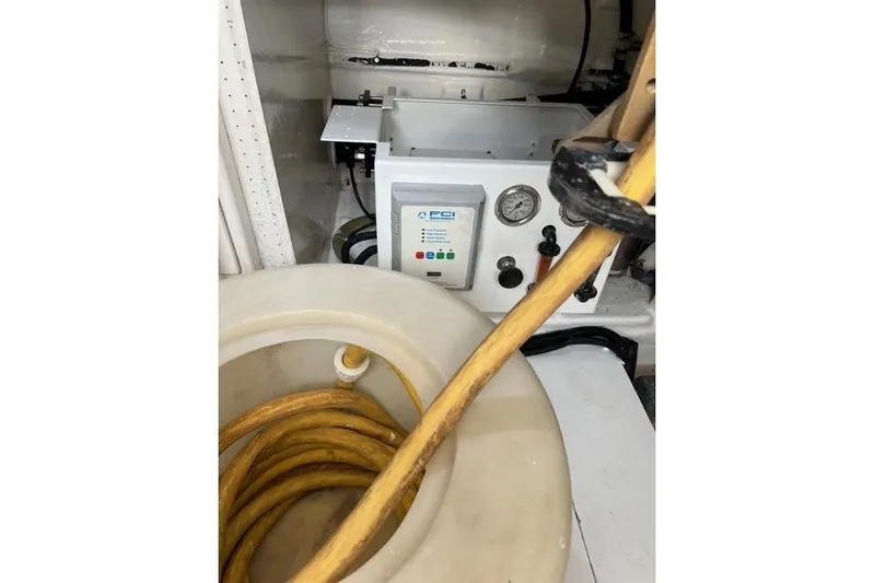  Yacht Photos Pics Engine room of 2006 Norseman 480S with equipment and coiled yellow hose.