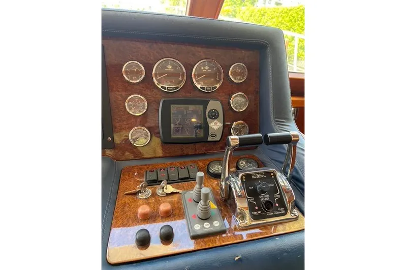  Yacht Photos Pics Control panel of a 2006 Norseman 480S boat with gauges and levers.