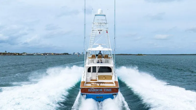 Harbor Time Yacht Photos Pics Viking 66 Open yacht cruising on water, rear view, 2013 model.