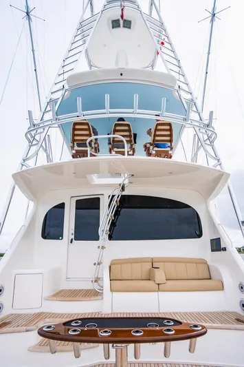 Harbor Time Yacht Photos Pics 2013 Viking 66 Open yacht with tower, seating, and fishing rod holders.