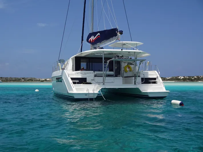 Second Treasure II Yacht Photos Pics 2020 Leopard 40 catamaran anchored in clear turquoise waters.