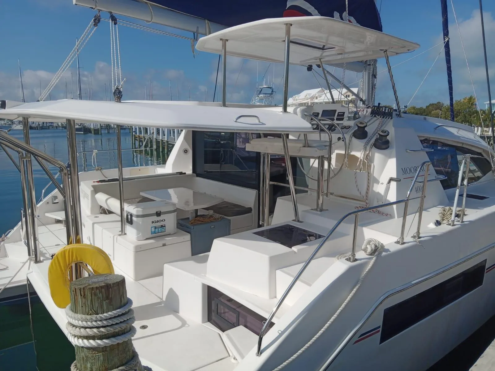 Leopard 40 catamaran, 2020 model, docked at marina with spacious deck and seating area.