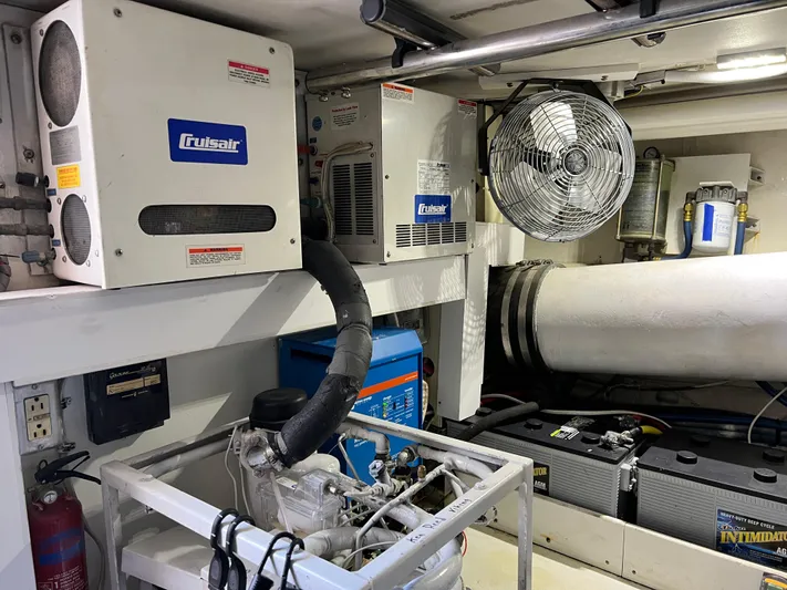Double Nickel Yacht Photos Pics Engine room of 1999 Viking 55 yacht with Cruisair systems and ventilation fan.