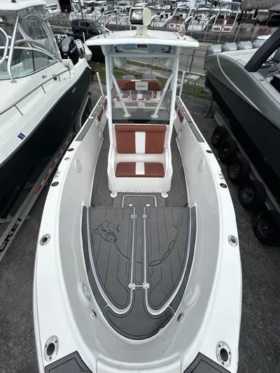 Cobia 254 Yacht Photos Pics 2001 Cobia 254 Center Console boat with sleek design and spacious deck.