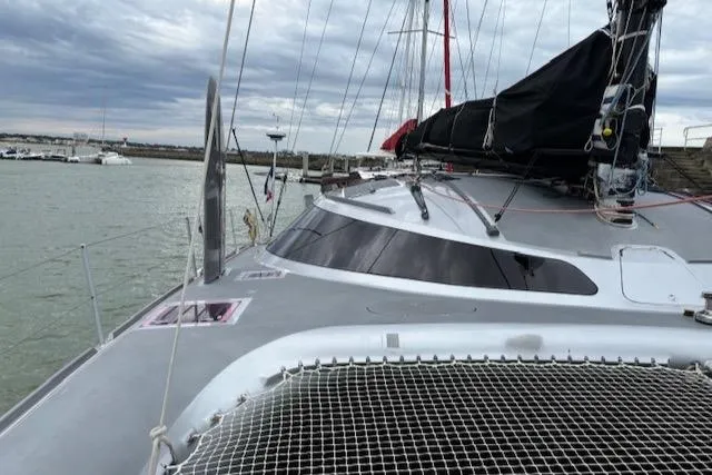 Obi One Yacht Photos Pics 2009 Catamaran Trimarine Carrera 57 docked, showcasing sleek design and rigging.