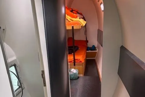 Obi One Yacht Photos Pics Interior cabin of 2009 Catamaran Trimarine Carrera 57 with bunk beds and cozy decor.