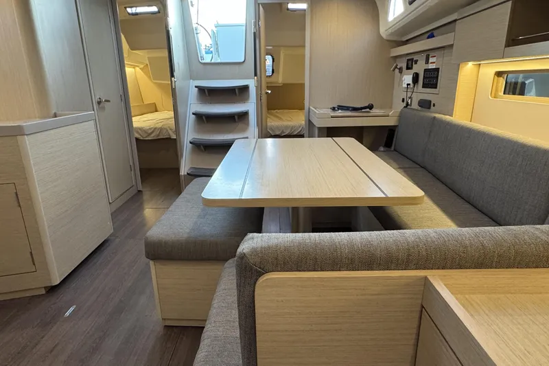 Madras Yacht Photos Pics Interior of 2022 Beneteau Oceanis 40.1 yacht, featuring modern dining area and cozy seating.