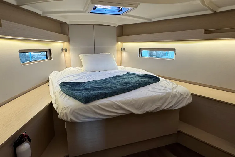 Madras Yacht Photos Pics Interior cabin of 2022 Beneteau Oceanis 40.1 yacht with cozy bed and modern design.
