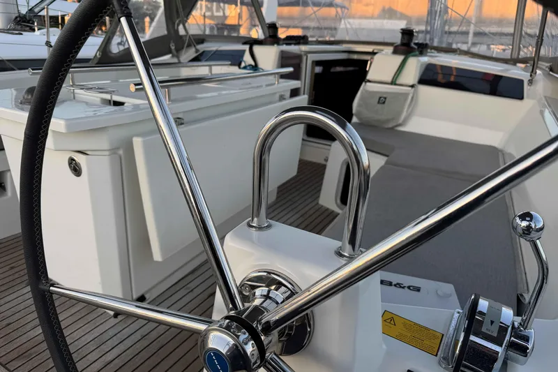 Madras Yacht Photos Pics 2022 Beneteau Oceanis 40.1 yacht cockpit with steering wheel and seating area.