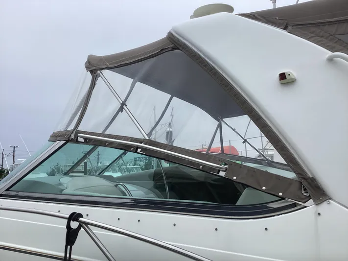 Four-some Fun Yacht Photos Pics 2001 Formula 40 PC boat with canvas cover and clear windows.