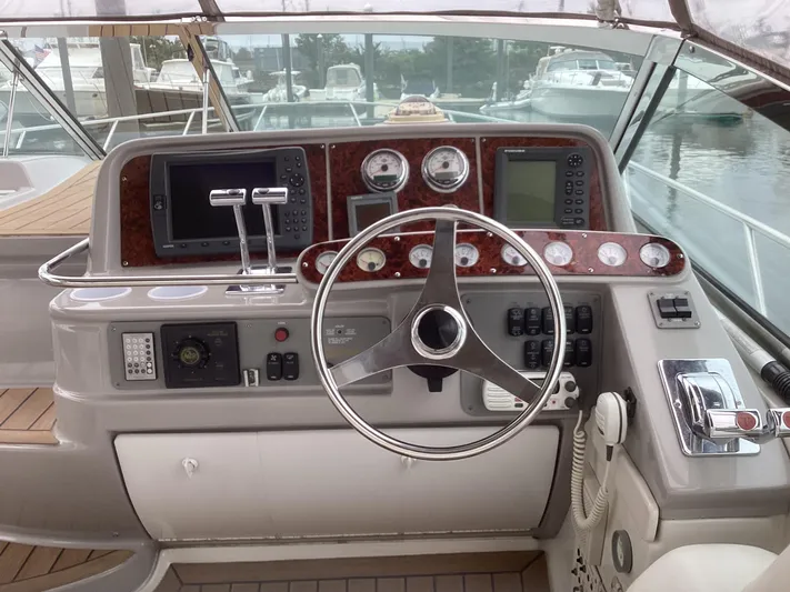Four-some Fun Yacht Photos Pics 2001 Formula 40 PC boat helm with steering wheel and navigation instruments.